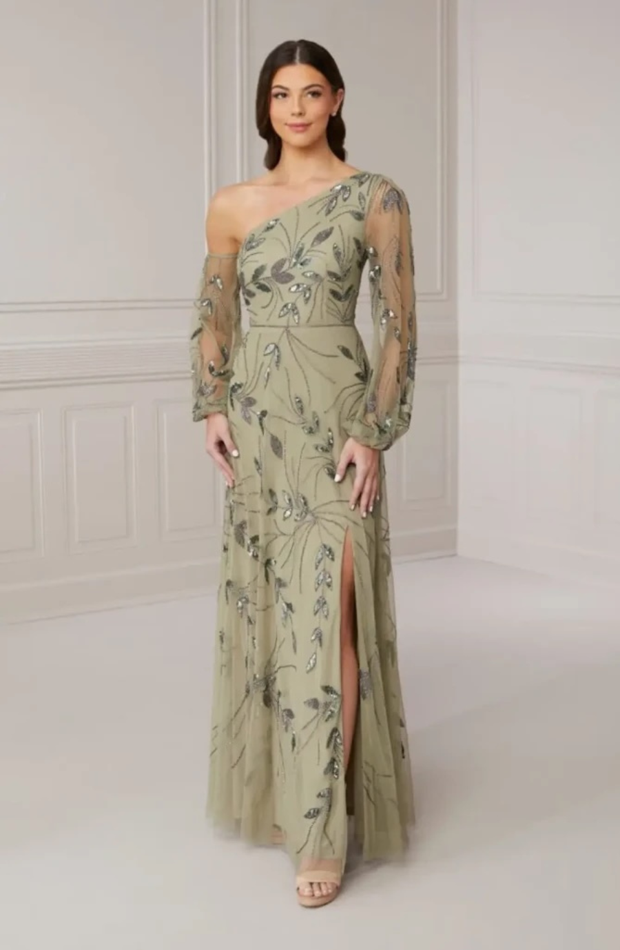 model is wearing a light green evening dress
